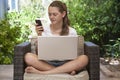 A young girl using her laptop outside Royalty Free Stock Photo