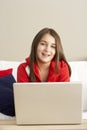 Young Girl Using Laptop At Home Royalty Free Stock Photo