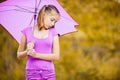 Young girl with violet umbrella