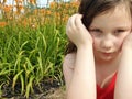 Young Girl With Vivid orange Flowers