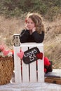 Young girl waiting at kissing stand Royalty Free Stock Photo