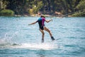 Young girl wakeboarding on a lake