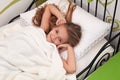 Young girl waking up with a smile Royalty Free Stock Photo