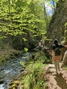 Young girl, walk on Hiking trail with wooden bridges over river Kamacnik, Gorski kotar