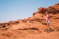 Young girl walking down the horse shoe bend cliffs Royalty Free Stock Photo