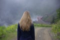 Young Girl Walking in Mountain Foggy Morning Landscape Royalty Free Stock Photo