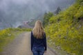 Young Girl Walking in Mountain Foggy Morning Landscape Royalty Free Stock Photo