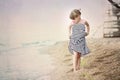 young girl walking on the sea coast Royalty Free Stock Photo