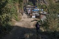 Young girl walking into a small mountain village