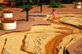 A young girl walks through a scale model of the Mississippi River