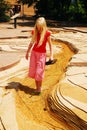 A young girl walks through a scale model of the Mississippi River