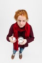 Top view portrait of young Caucasian girl feeling sick and taking pills isolated over white background. Medical