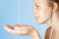 Young girl washes with clean water