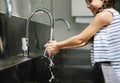 Young girl washing hands with water Royalty Free Stock Photo