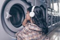 Young girl at a washing machine Royalty Free Stock Photo