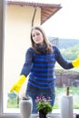 Young girl washing windows Royalty Free Stock Photo