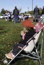 Young girl watches as the youth football team warms up