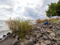 Young girl watching the Sea of Galilee seen at Capernaum, Israel Royalty Free Stock Photo