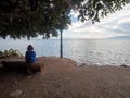 Young girl watching the Sea of Galilee seen at Capernaum, Israel Royalty Free Stock Photo