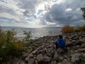 Young girl watching the Sea of Galilee seen at Capernaum, Israel Royalty Free Stock Photo