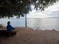 Young girl watching the Sea of Galilee seen at Capernaum, Israel Royalty Free Stock Photo