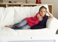 Young Girl Watching Television at Home Royalty Free Stock Photo