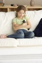 Young Girl Watching Television at Home