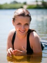 Young girl in the water in summer river