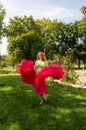 A young girl waving a pink dress. Blonde in a pink dress Royalty Free Stock Photo