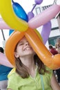 Young girl wearing a balloon hat