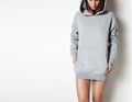 Young girl wearing blank and oversize long hoody. White background Royalty Free Stock Photo