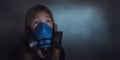 Young girl wearing gasmask, respirator portrait