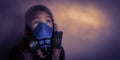 Young girl wearing gasmask, respirator portrait