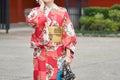 Young girl wearing Japanese kimono standing in front of Sensoji Temple in Tokyo, Japan. Kimono is a Japanese traditional garment. Royalty Free Stock Photo