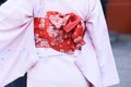 Young girl wearing Japanese kimono standing in front of Sensoji Temple in Tokyo, Japan. Kimono is a Japanese traditional garment. Royalty Free Stock Photo