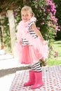 Young Girl Wearing Pink Wellington And Feather Boa Royalty Free Stock Photo