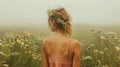 Young girl wearing a wreath of wild flowers on her head, walking in the green misty meadow. Harmony with nature. Generative AI Royalty Free Stock Photo