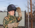 A young girl welder in working clothes
