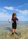 Young girl with wetsuit, masks and snorkels at the s Royalty Free Stock Photo