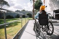 YOUNG GIRL ON A WHEELS CHAIR