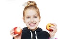 Young girl on a white background holds two red apples in her hands Royalty Free Stock Photo