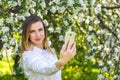 Young girl takes selfie on smartphone Royalty Free Stock Photo