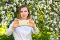 Young girl takes selfie on smartphone Royalty Free Stock Photo