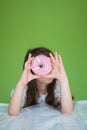 girl in a white dress is going to eat a sweet donut Royalty Free Stock Photo