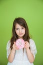 Young girl in a white dress is going to eat a sweet donut Royalty Free Stock Photo