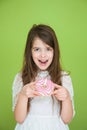 Young girl in a white dress is going to eat a sweet donut Royalty Free Stock Photo