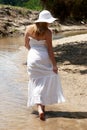 The young girl in white going on river