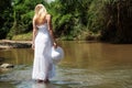 The young girl in white going on river