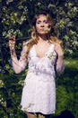 Young girl a white little flowers Royalty Free Stock Photo