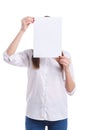 The girl covers her face with a white sheet of paper on a white background